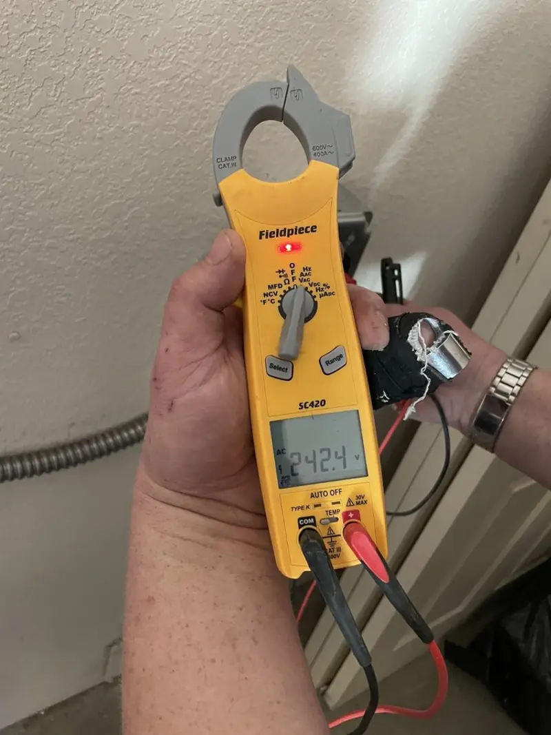 Voltage testing with clamp meter during Recessed Lighting Installation in Saratoga